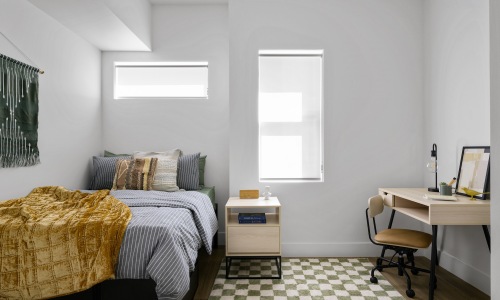 Bedroom with natural lighting and high ceilings