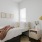 furnished bedroom with large window