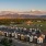 neighborhood view of Boötes surrounded by fields, forest and mountains