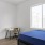 large windows brighten bedroom
