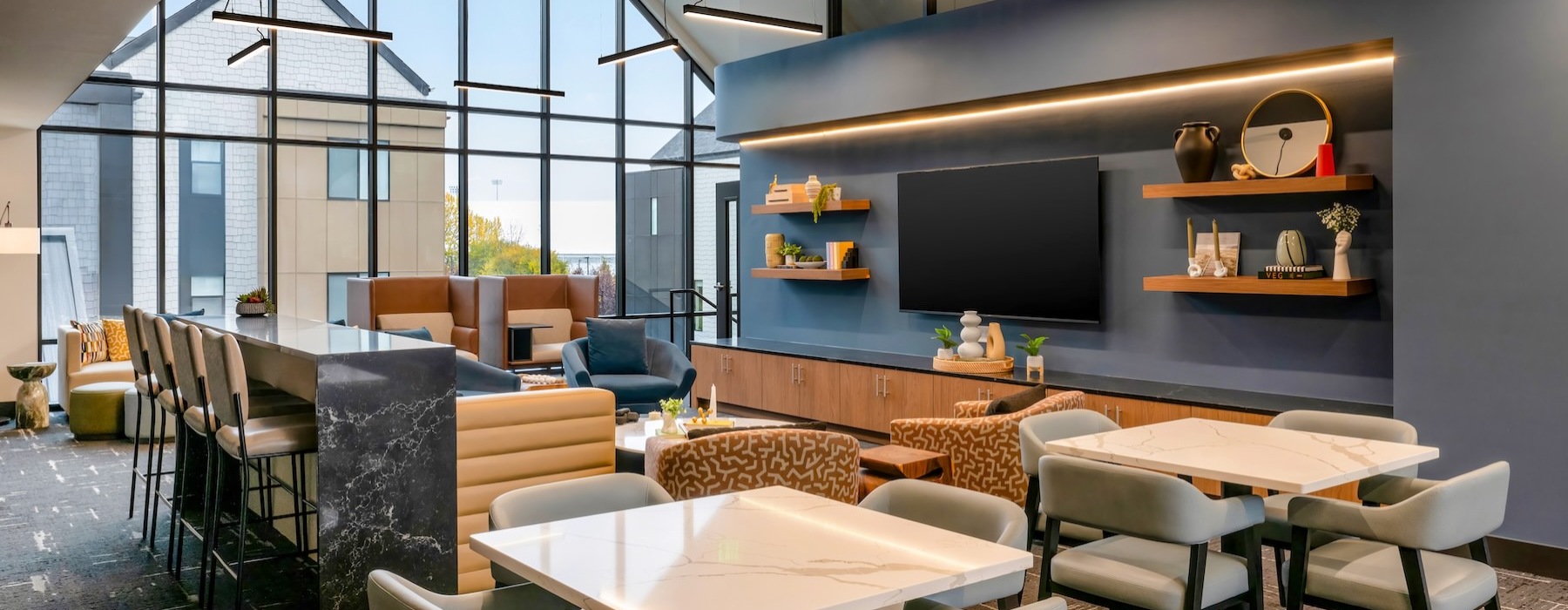 a spacious clubroom with a tv