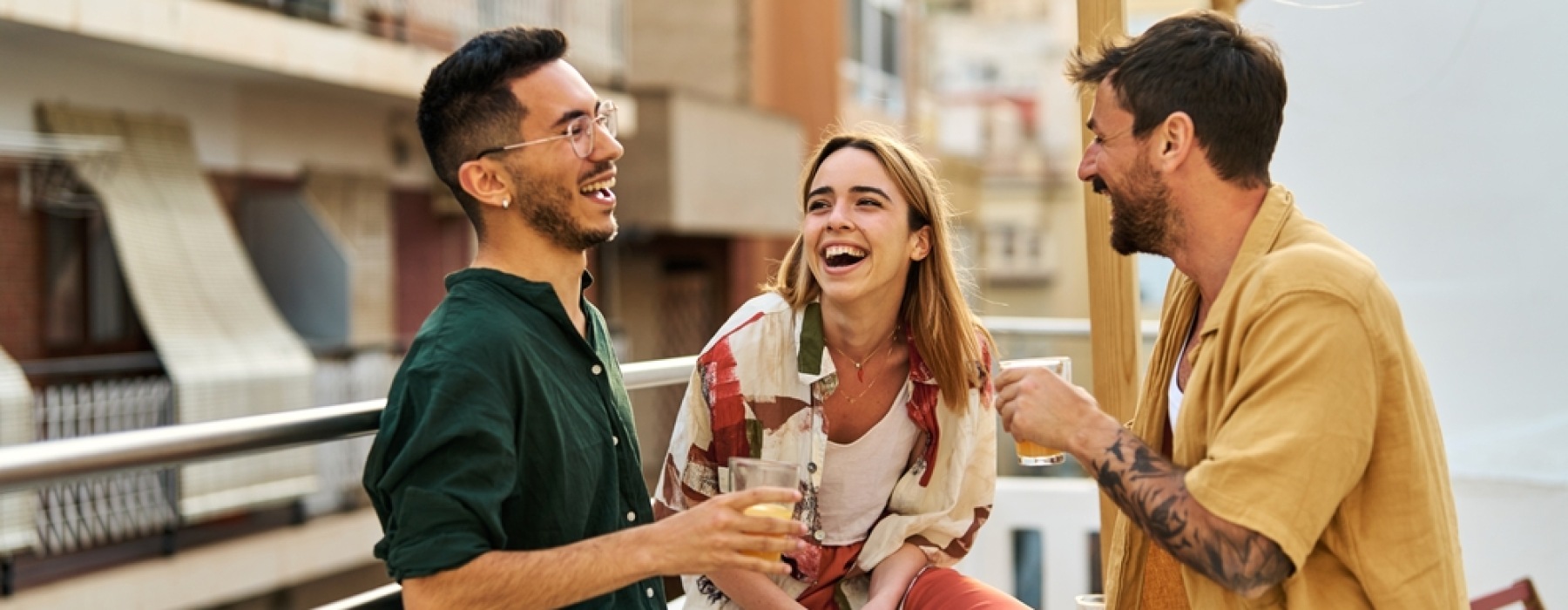 Three people talking and laughing 