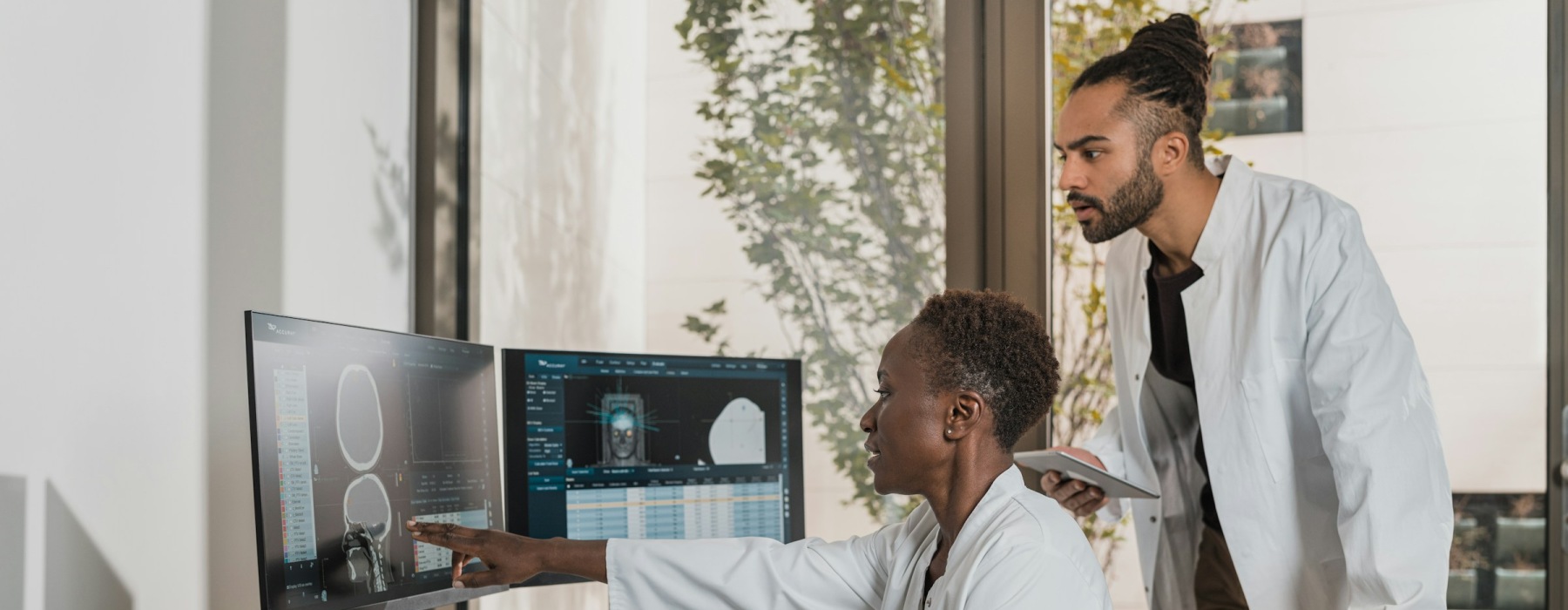 two doctors looking at the computer