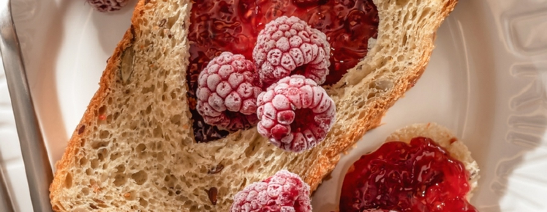 toast with red heart and raspberries